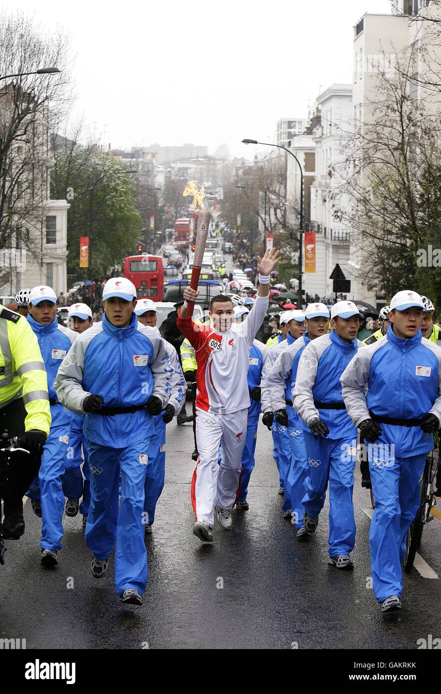 The torch nears Notting Hill the Beijing Olympics torch relay, heading towards Blenheim Cresent in London. Stock Photo