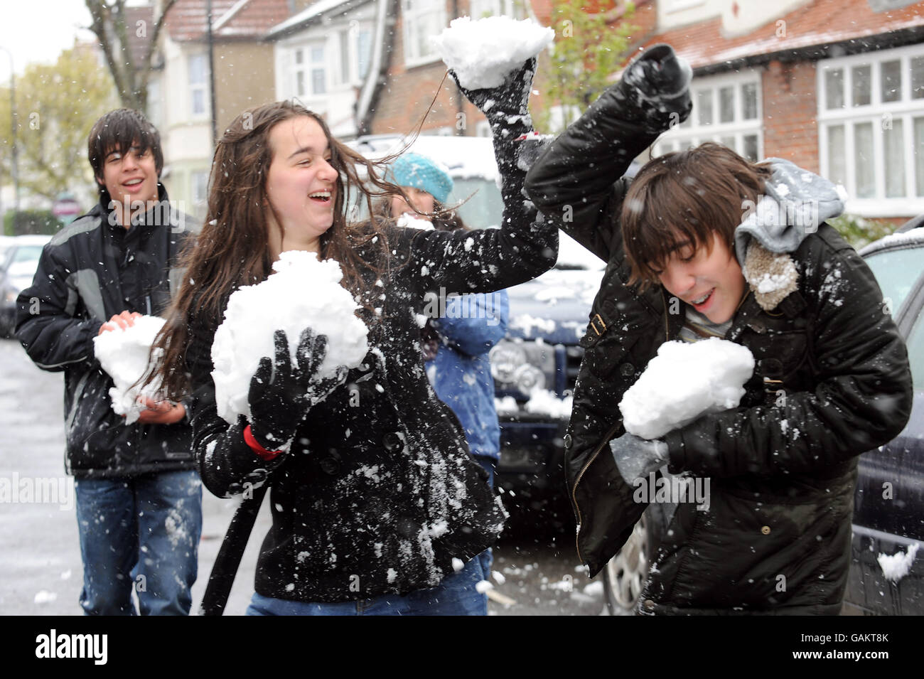 Weather, Snow Hits the UK, 2008. Teenagers have a snowball fight in Chiswick, West London. Stock Photo