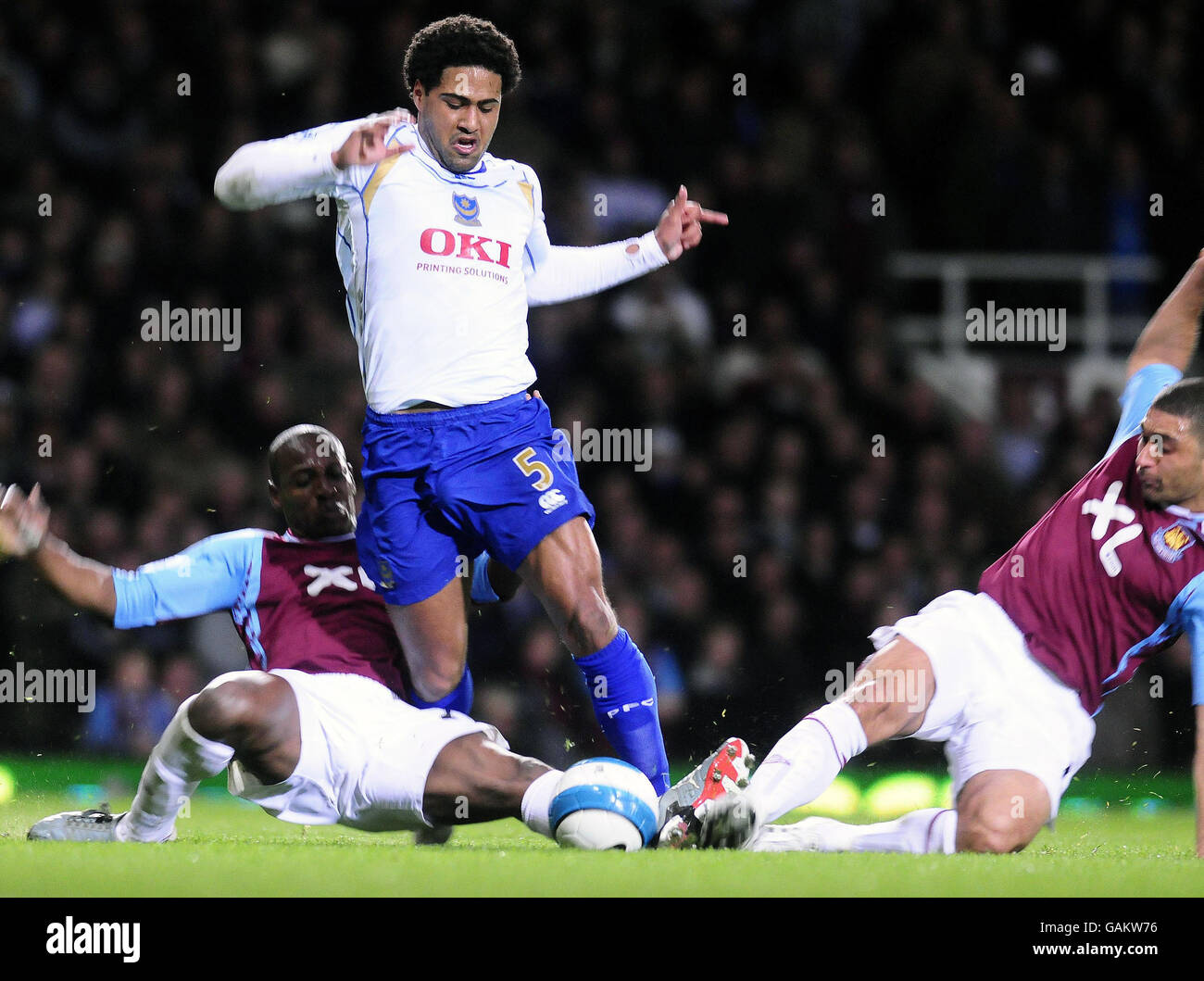 Soccer - Barclays Premier League - West Ham United v Portsmouth - Upton Park. Portsmouth's Glen Johnson tussles for the ball during the Barclays Premier League match at Upton Park, London. Stock Photo