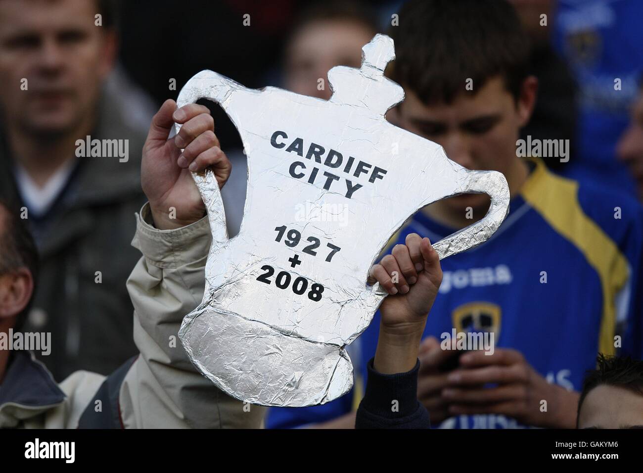 Soccer - FA Cup - Sixth Round - Middlesbrough v Cardiff City - The Riverside Stadium. Cardiff City fans hold up a cardboard cut out of the FA Cup in the stands Stock Photo