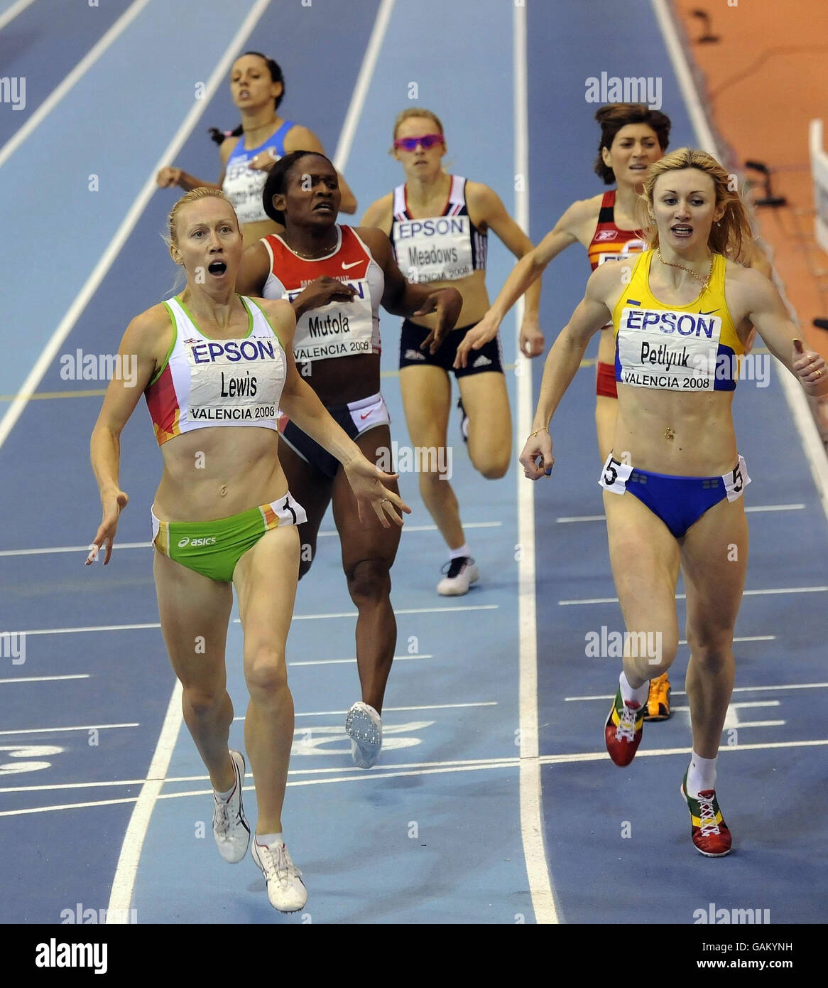 Australia's Tamsyn Lewis appears shocked as she beats Maria Mutola into third place with Great Britain's Jenny Meadows behind in the Finals of the Womens 8800m Event during the IAAF World Indoor Championships at the Palau Velodromo Luis Puig in Valencia, Spain. Stock Photo