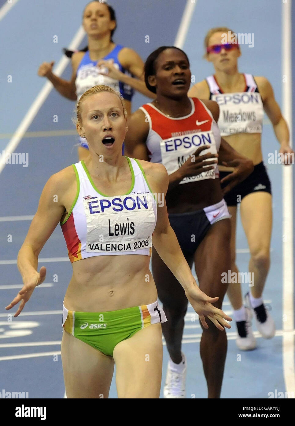 Australia's Tamsyn Lewis appears shocked as she beats Maria Mutola into third place with Great Britain's Jenny Meadows behind in the Finals of the Womens 8800m Event during the IAAF World Indoor Championships at the Palau Velodromo Luis Puig in Valencia, Spain. Stock Photo