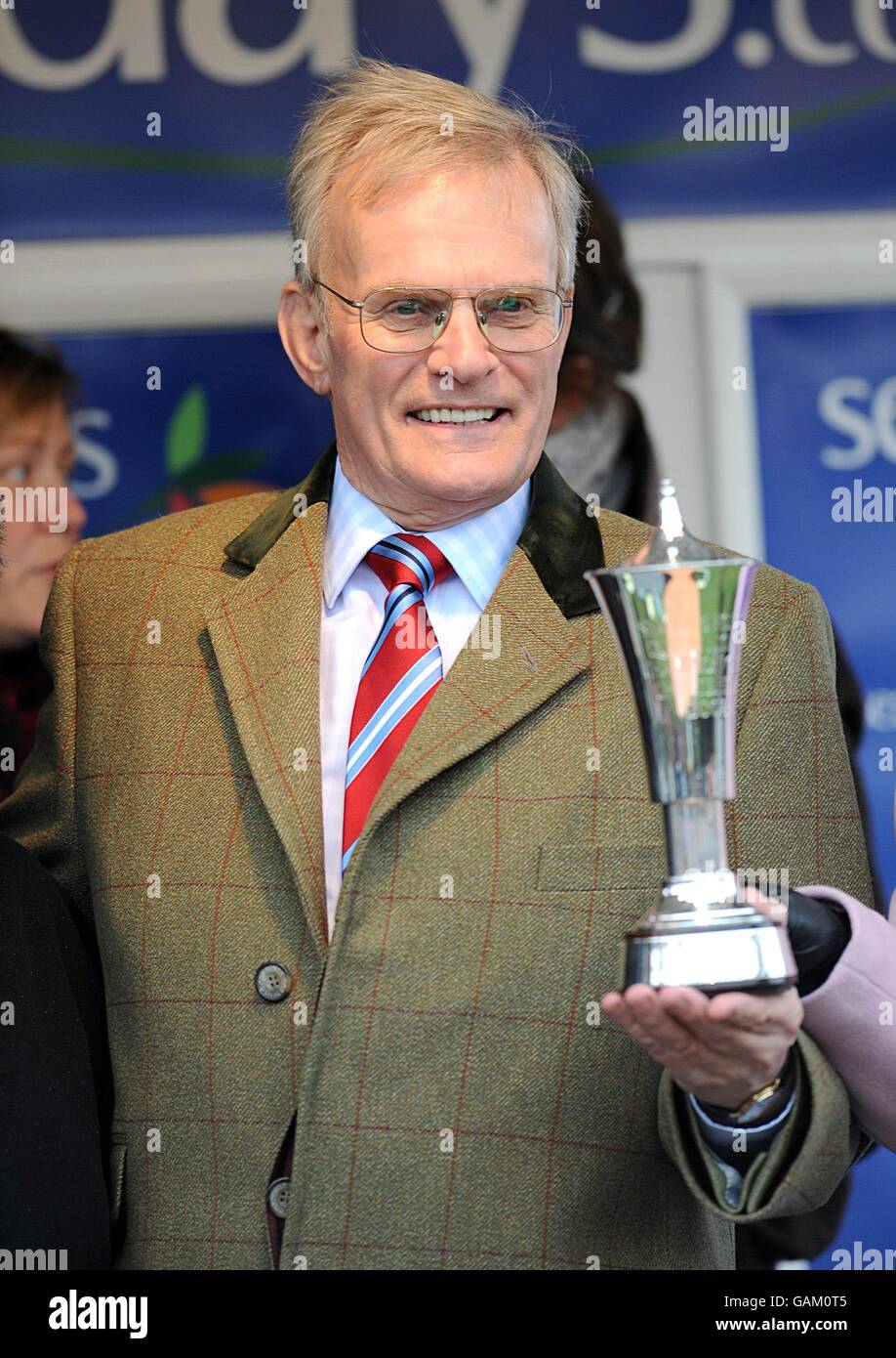 Owner Clive Smith celebrates with the trophy after winning with Master