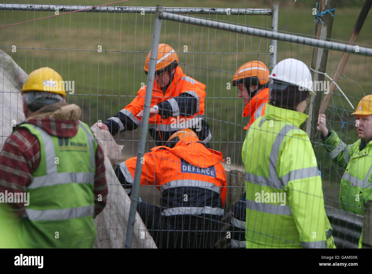 Civil Defence rescue teams arrive to remove a protestor who has ...