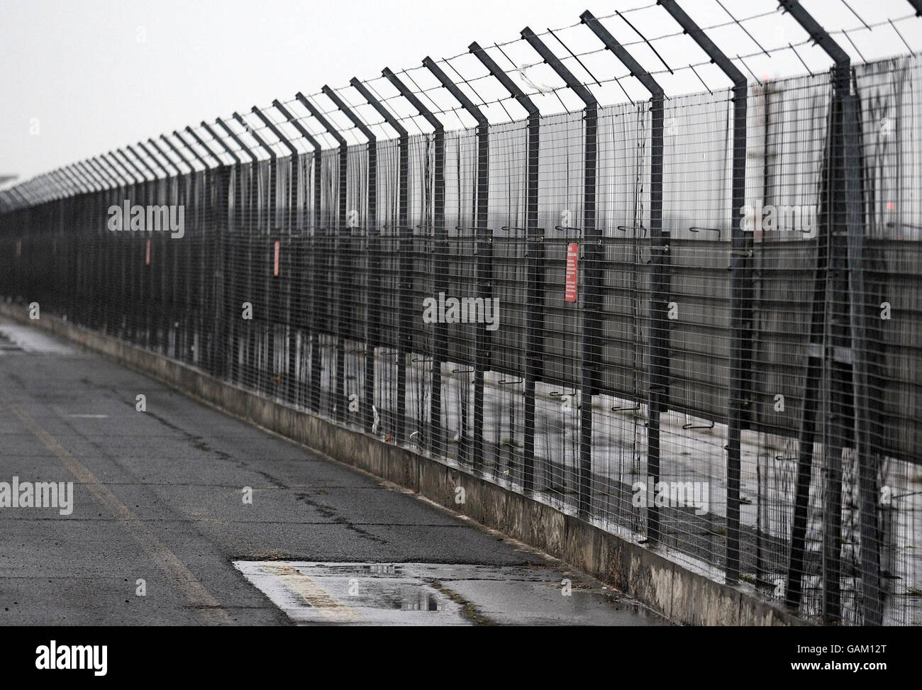 The perimeter fence around Heathrow Airport on the north side, where a man climbed over this afternoon, sparking a security scare at the airport. Stock Photo