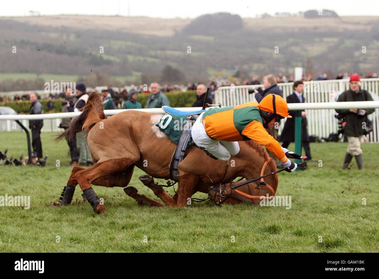 Horse Racing - Cheltenham Festival - Day Three - Cheltenham Racecourse. In Accord, ridden by jockey Thomas Greenall, falls in the Peter O'Sullevan National Hunt Chase Challenge Cup during the Cheltenham Festival. Stock Photo