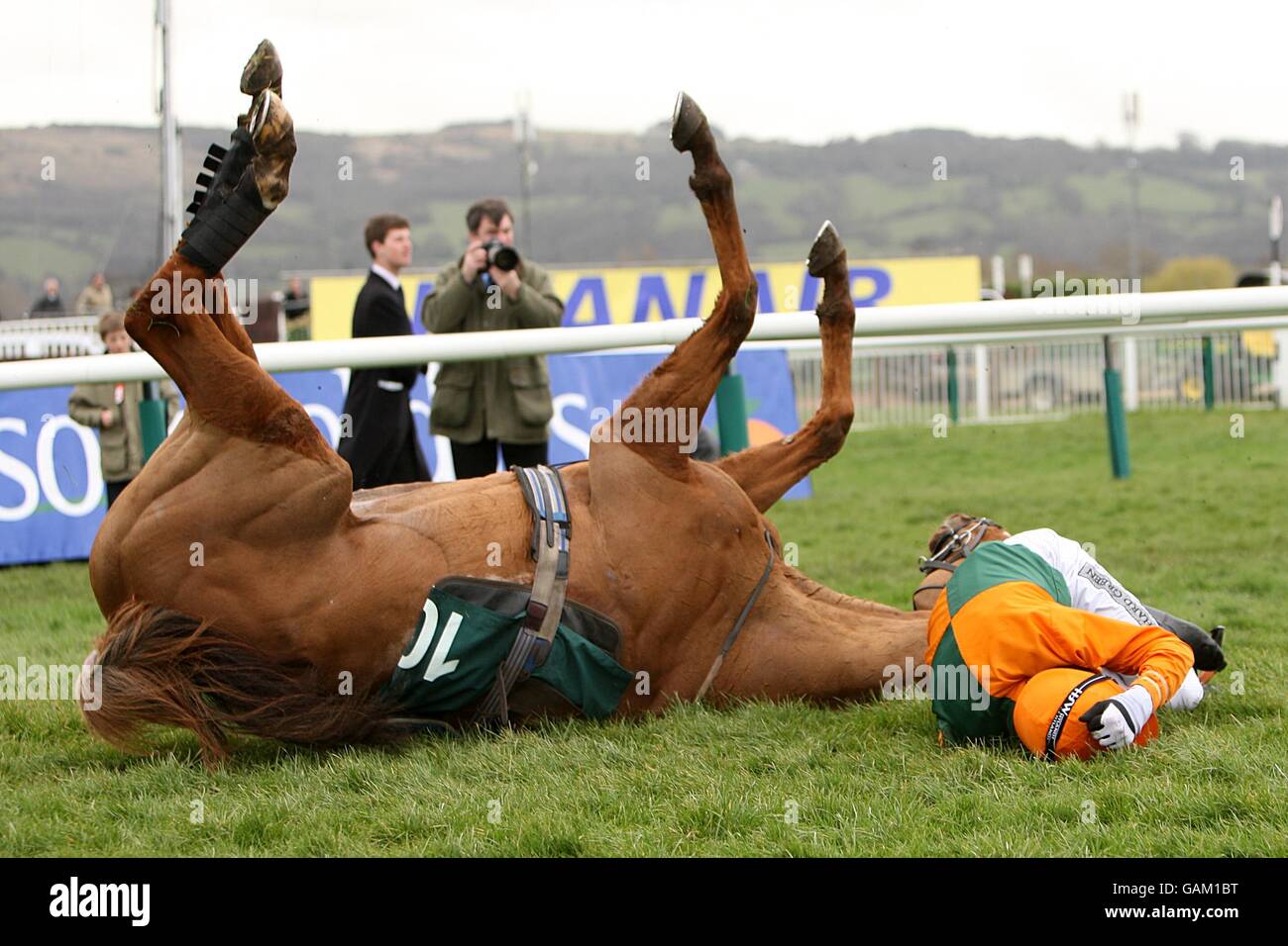 In Accord, ridden by jockey Thomas Greenall, falls in the Peter O'Sullevan National Hunt Chase Challenge Cup during the Cheltenham Festival. Stock Photo