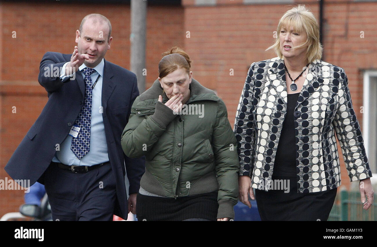 Karen Matthews (centre) mother of Shannon Matthews, leaves her home in