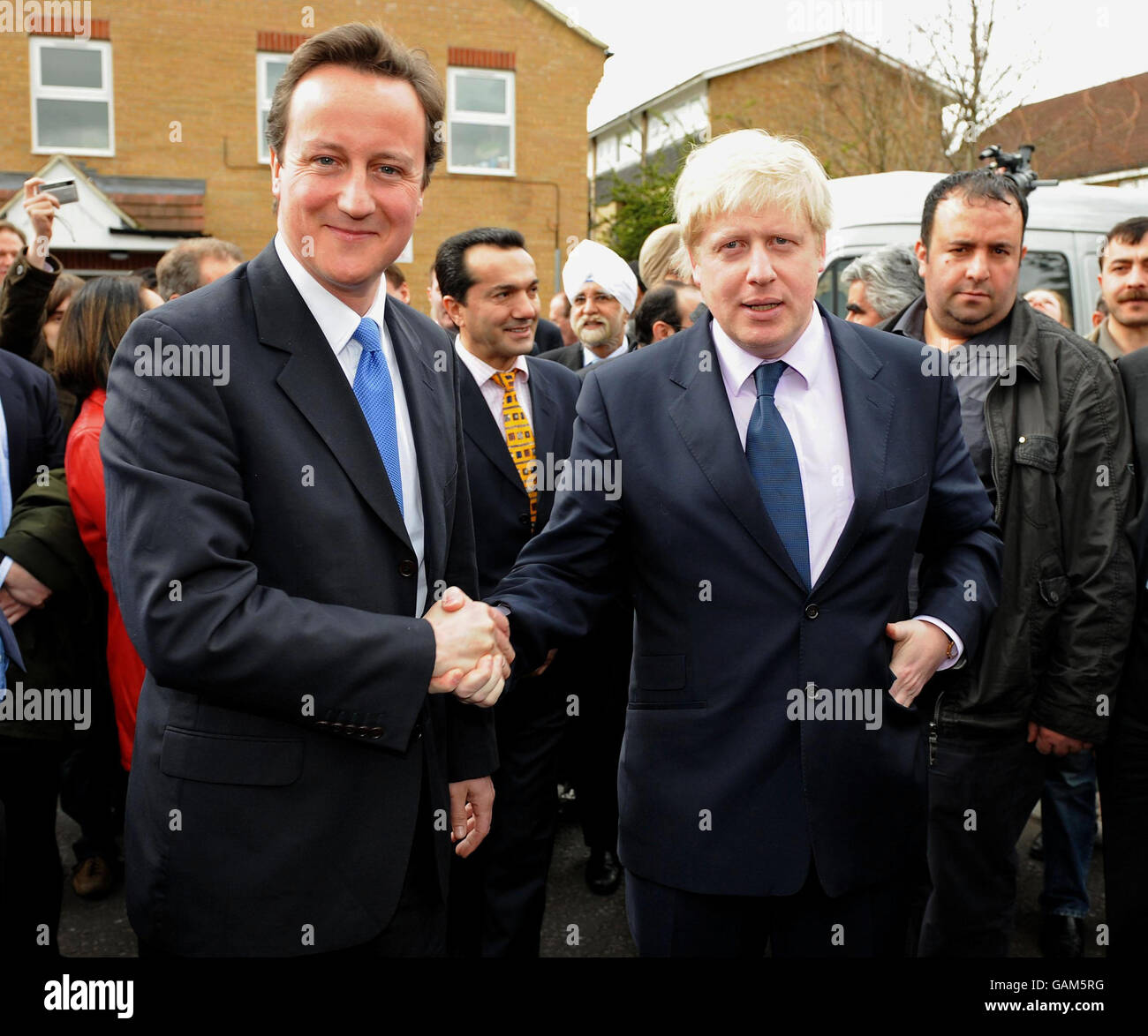 Conservative Leader David Cameron shakes the hand of Conservative candidate for Mayor of London Boris Johnson, who has today launched the final phase of his mayoral campaign at Bounces Road Community Hall, North London today. Stock Photo