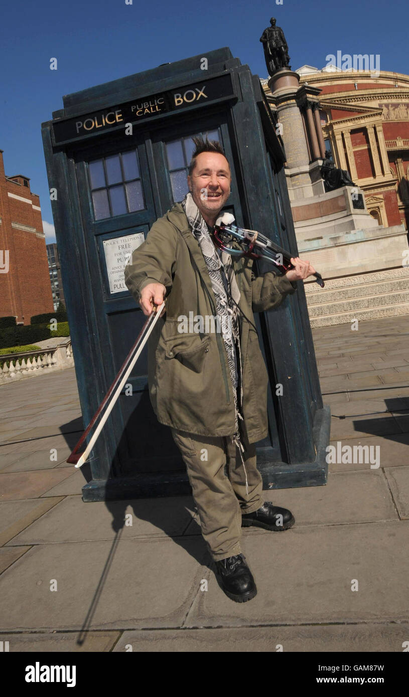 British musician Nigel Kennedy plays the theme to the classic children's televison programme Doctor Who on his electric violin outside London's Albert Hall ahead of the BBC Proms, which he will launch with the performance. Stock Photo