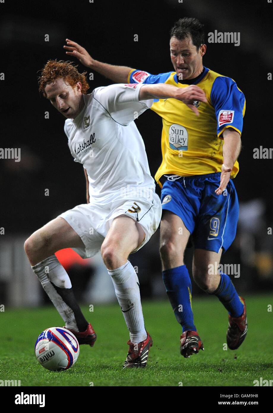 Milton Keynes Dons' Dean Lewington and Hereford United's Stephen Guinan battle for the ball. Stock Photo