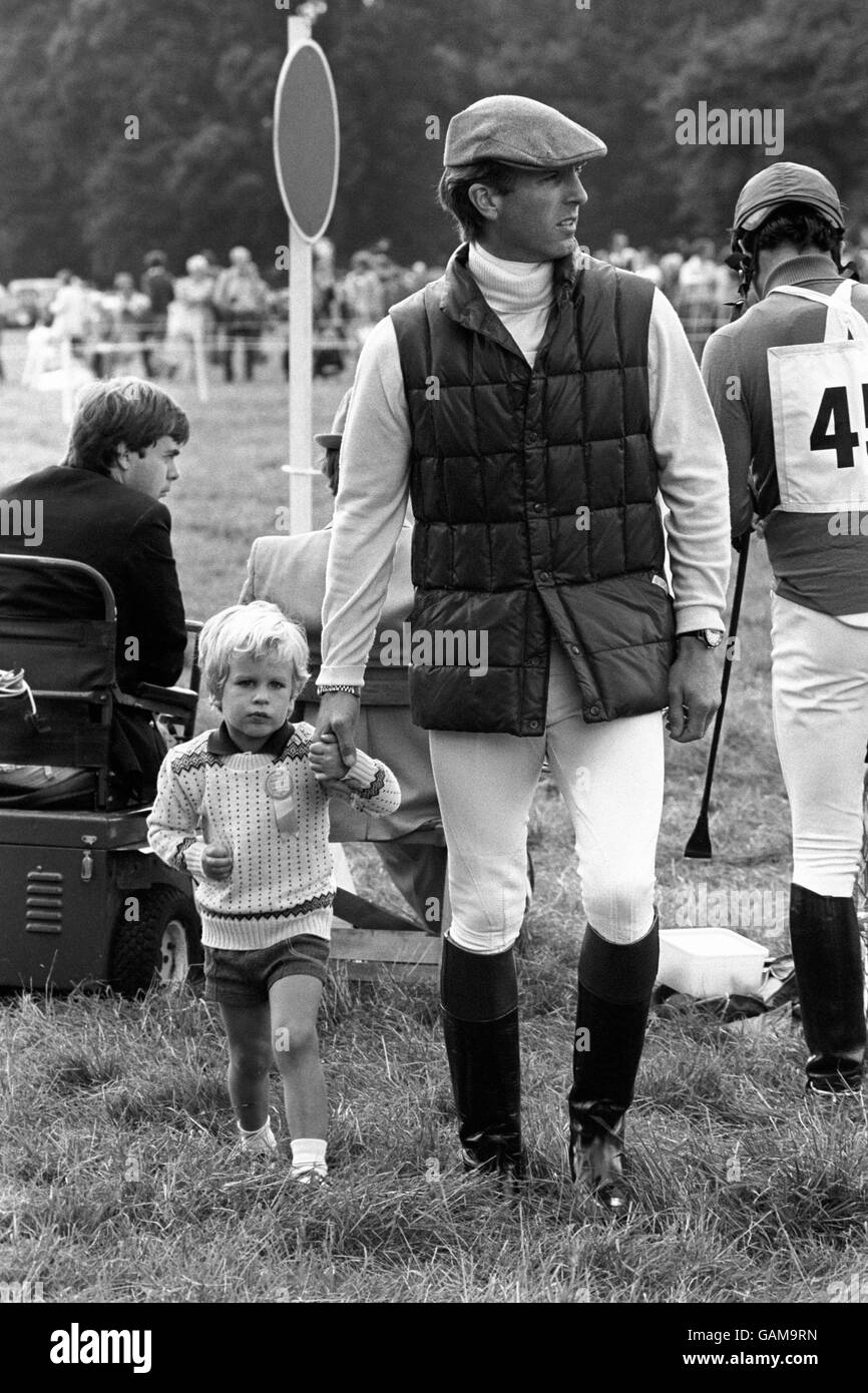 Capt. Mark Phillips with his son Peter Phillips while wife and mother Princess Anne takes her turn in the Burghley Horse trials, Stamford Lincolnshire. Princes Anne took a tumble at the 20th fence in the cross country section, a log over a drop into water, Capt. Phillips was competing in the same event. Stock Photo