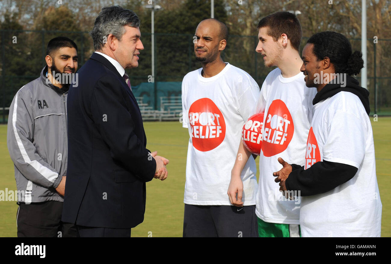 Prime Minister Gordon Brown meets members of the Street League football scheme, one of the charities that benefits from Sport Relief. From left to right: Coach Rizwan Aboo, and footballers Sirak Tecle, Paul White and Anwar Nouray. Stock Photo