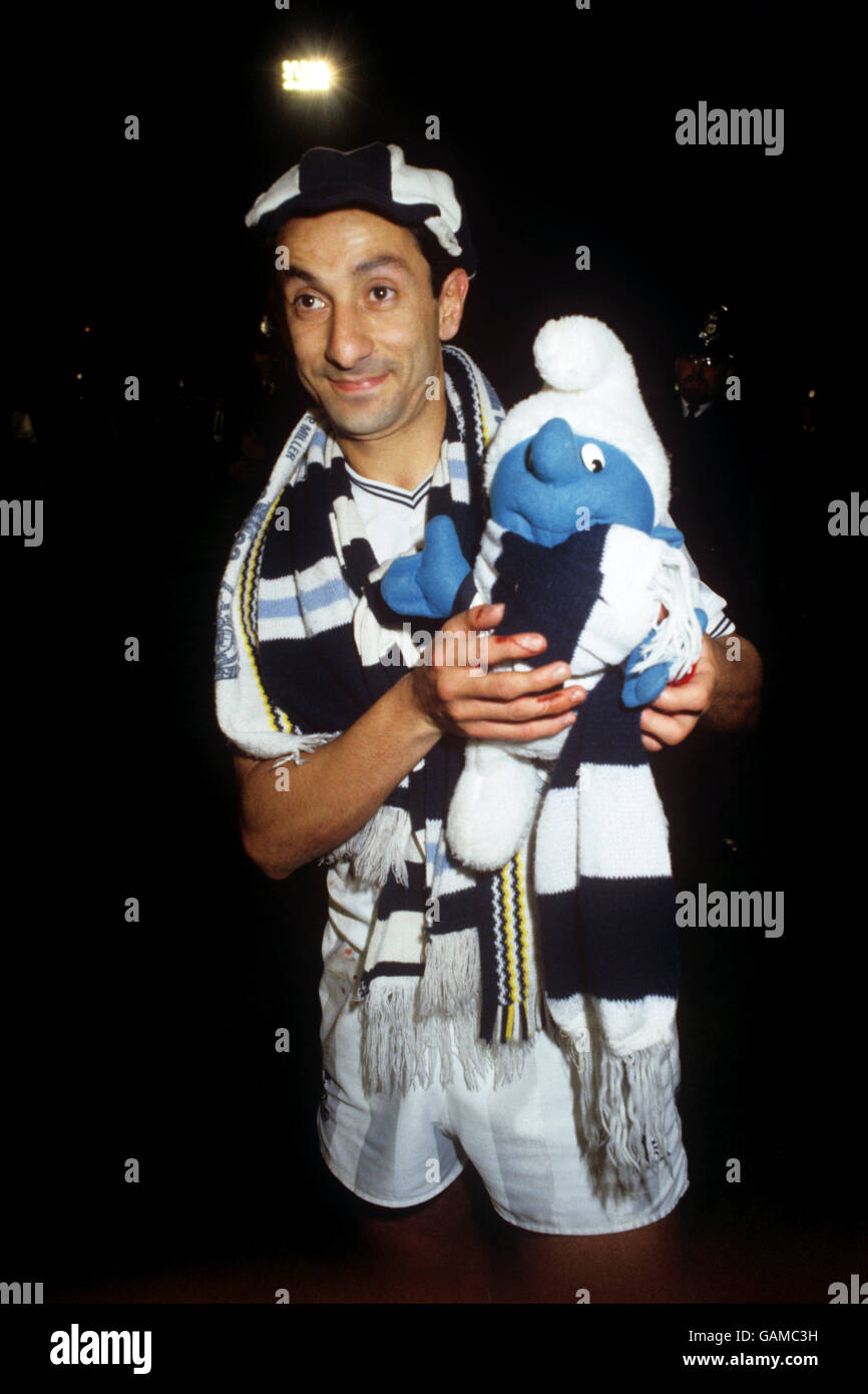 ossie-ardiles-celebrates-with-a-toy-smurf-after-spurs-win-in-the-uefa-GAMC3H.jpg