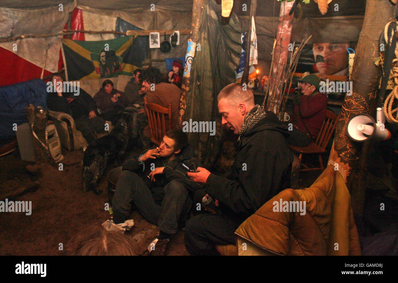 Members of the Rath Lugh Direct Action group relax in a tent they have ...