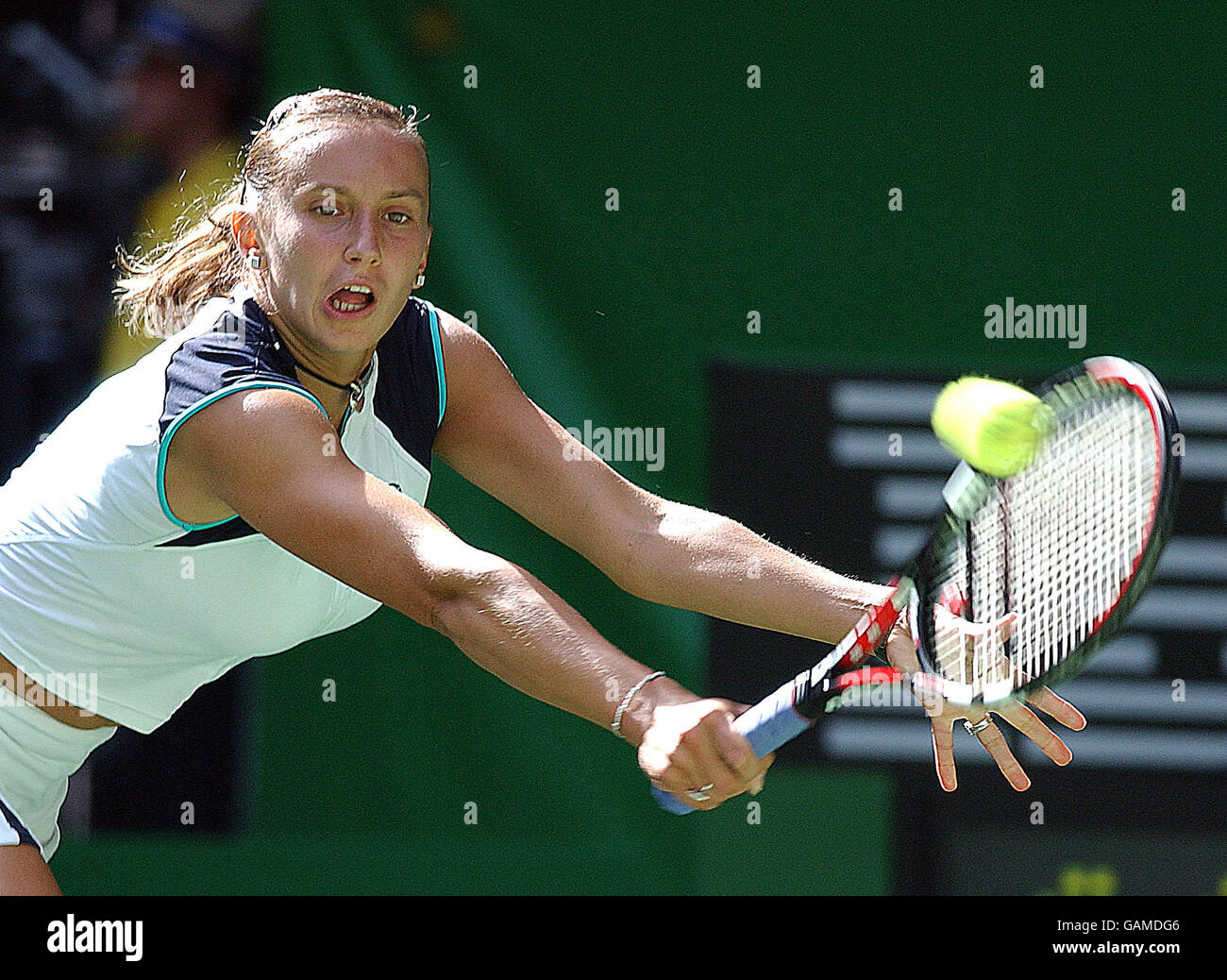 Iroda Tulyaganova (UZB) makes a return back to Lindsay Davenport (USA). Stock Photo