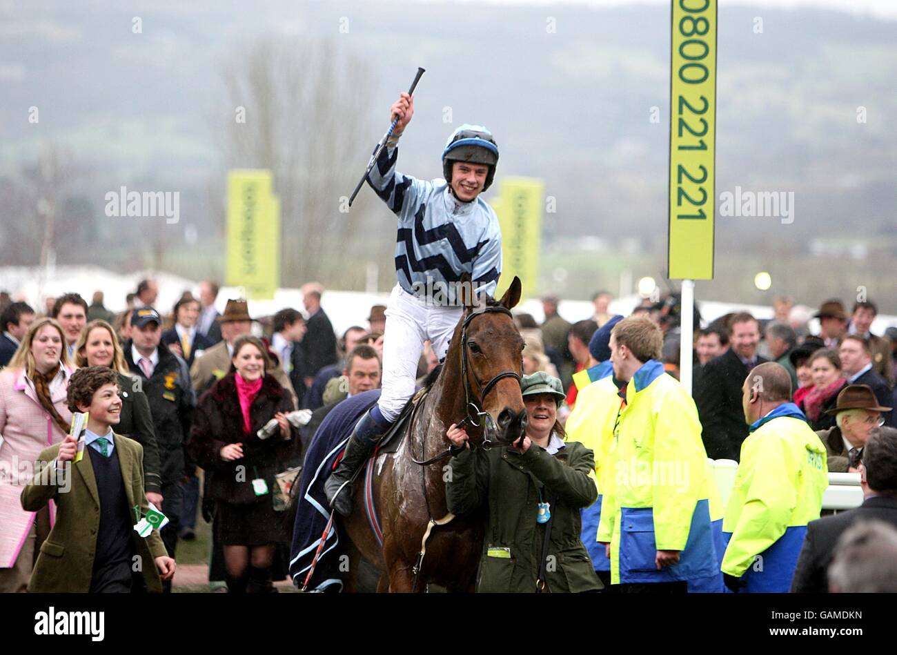 Jockey Thomas Greenall on Amicelli celebrates after winning in the Christie's Foxhunter Chase Challenge Cup during the Cheltenham Festival Stock Photo