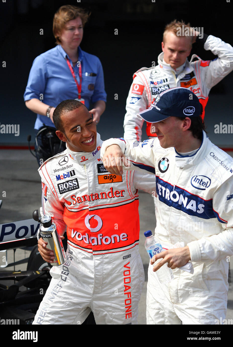 Great Britain's Lewis Hamilton celebrates his pole position with second placed Robert Kubica during qualifying at Albert Park, Melbourne, Australia. Stock Photo