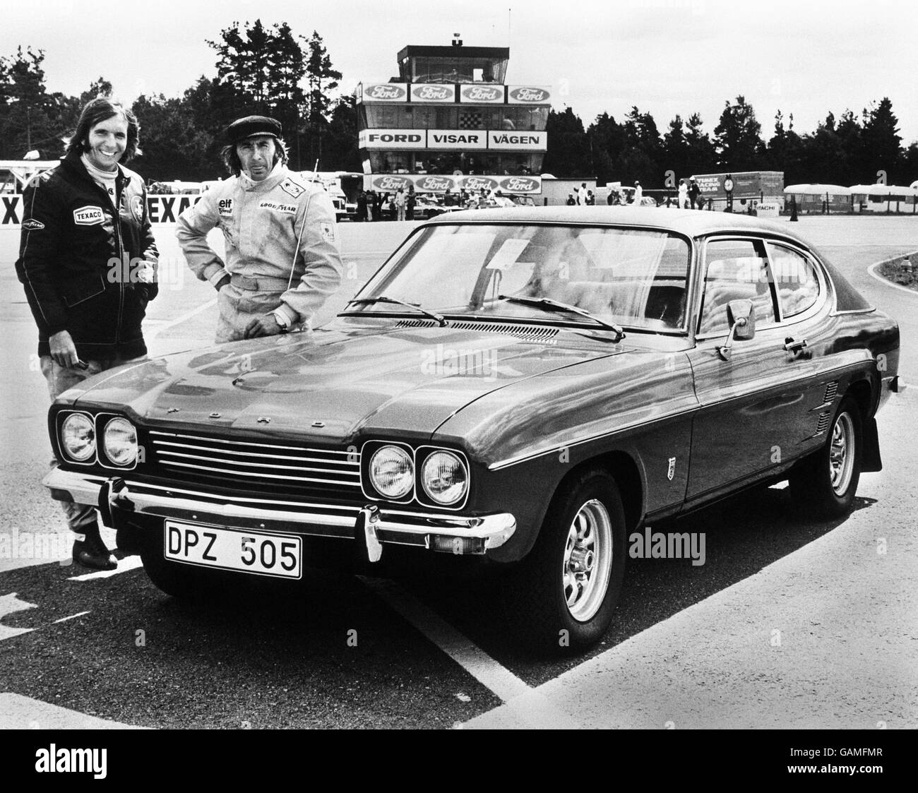 British racing driver Jackie Stewart (right) with Brazilian racing driver Emerson Fittipaldi and their Ford Capri RS 2600 for a race in Germany. Stock Photo