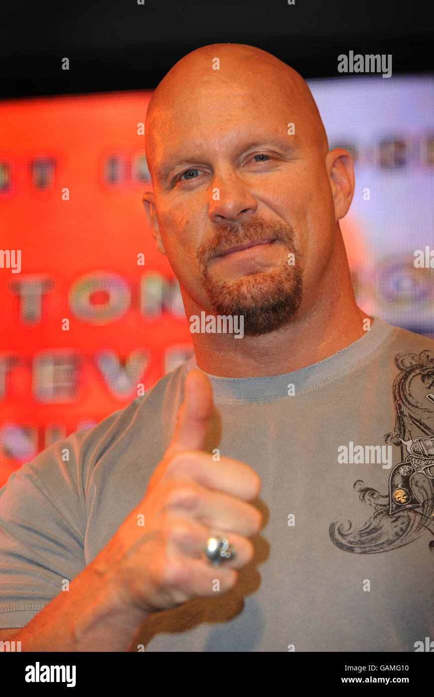 Six-time former WWE Champion Stone Cold Steve Austin punches the air at the HMV store in central London, as he promotes the release of his latest DVD, 'The Legacy of Stone Cold Steve Austin'. Stock Photo