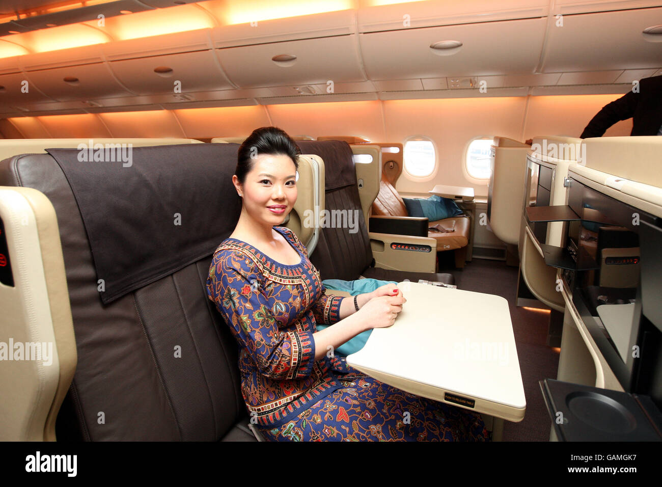 Generic picture of a stewardess siting in a Business class seat onboard the Singapore Airlines Airbus 380 after it landed at Heathrow Airport after its first commercial flight to the UK. PRESS ASSOCIATION Photo. Picture date: Tuesday March 18, 2008. Photo credit should read: Steve Parsons/PA Wire Stock Photo