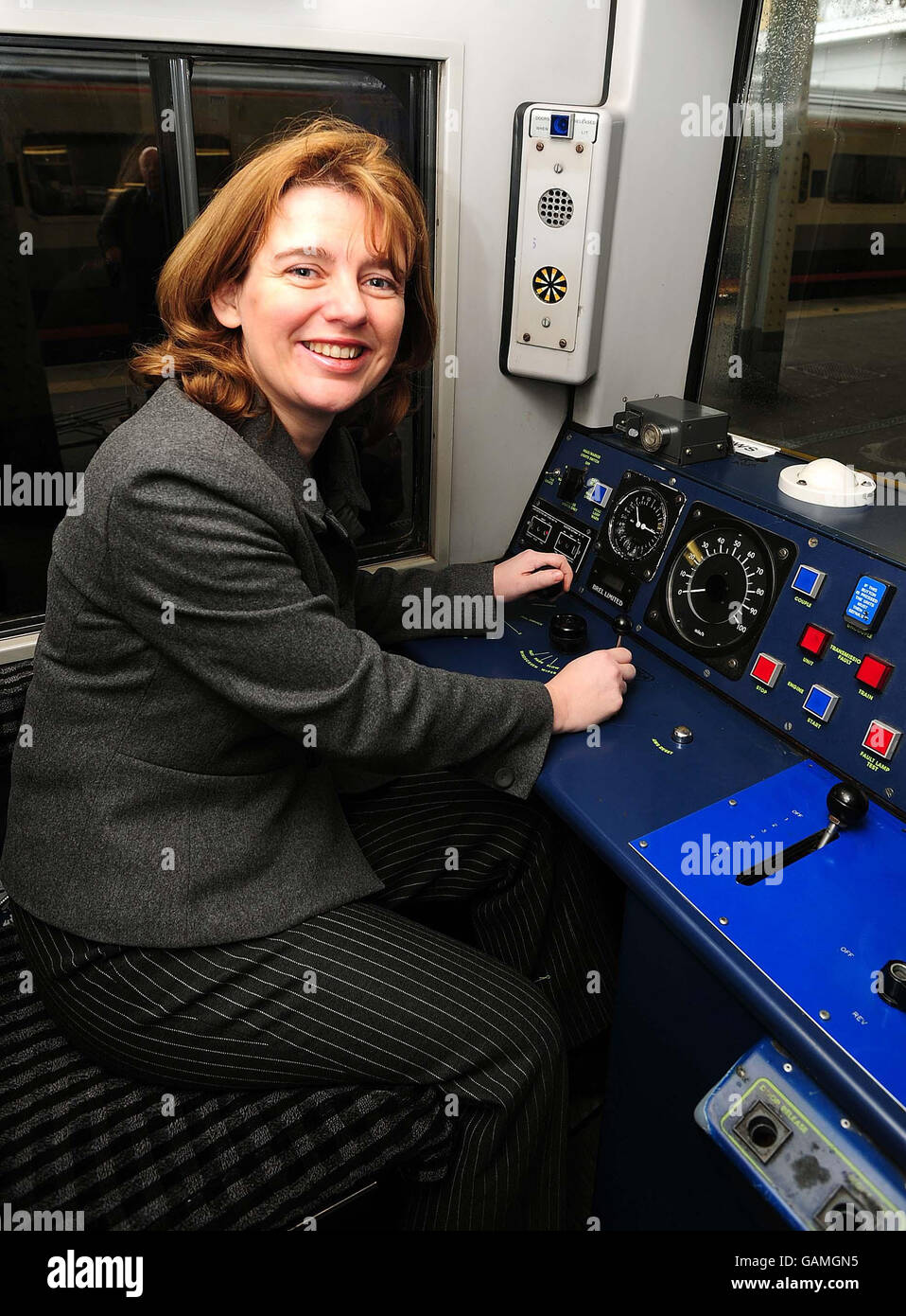 Transport Secretary Ruth Kelly in the driver's cabin of a commuter