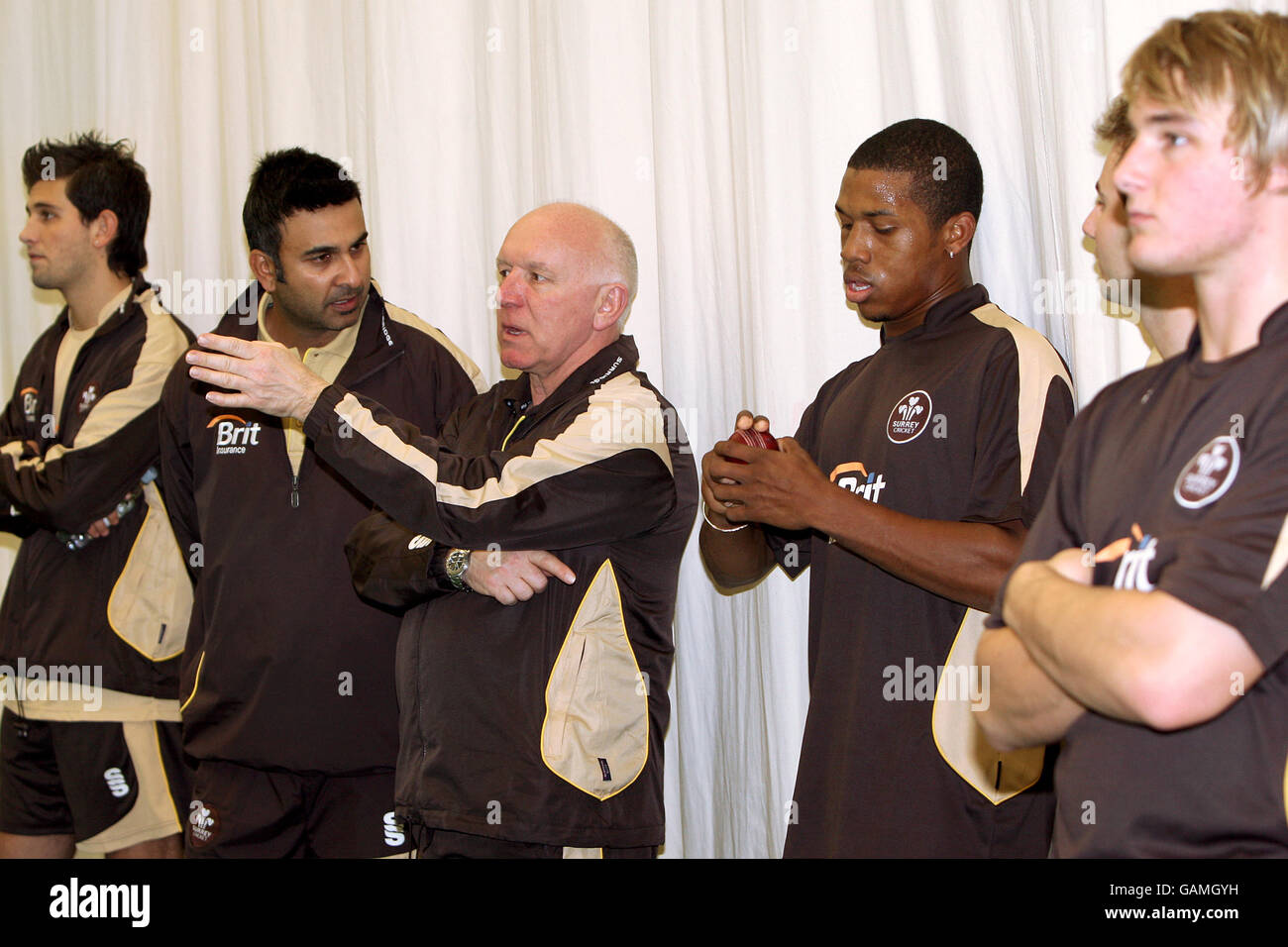 Surrey County Cricket coach Alan Butcher (c) chats with (l-r) Jade Dernbach, Nadeem Shahid (assistant coach), Chris Jordan and Laurie Evans at the Guildford Cricket Show Stock Photo