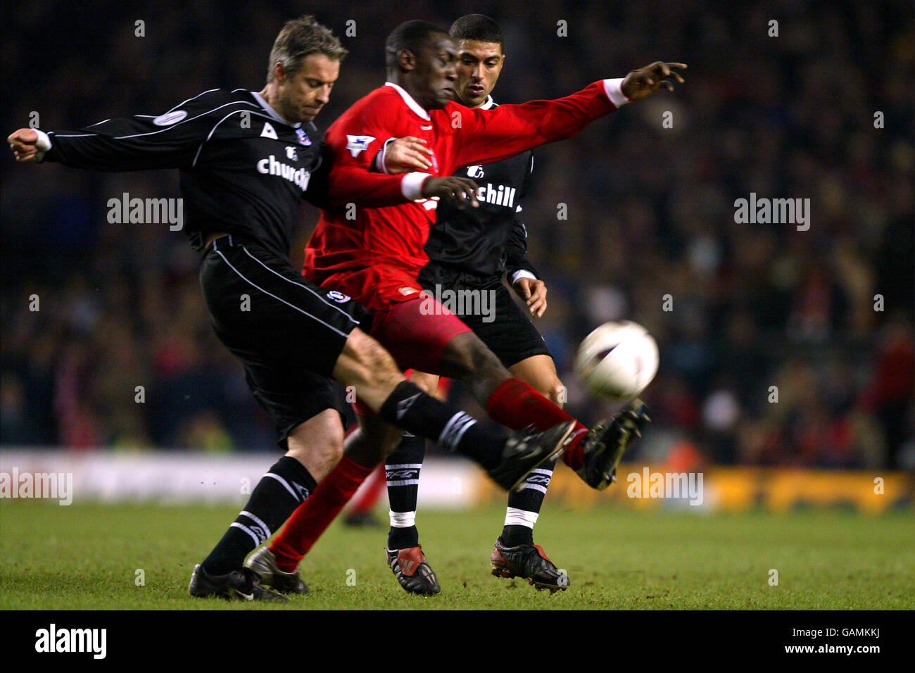 Liverpool's Emile Heskey (c) tries to control the ball between Crystal ...