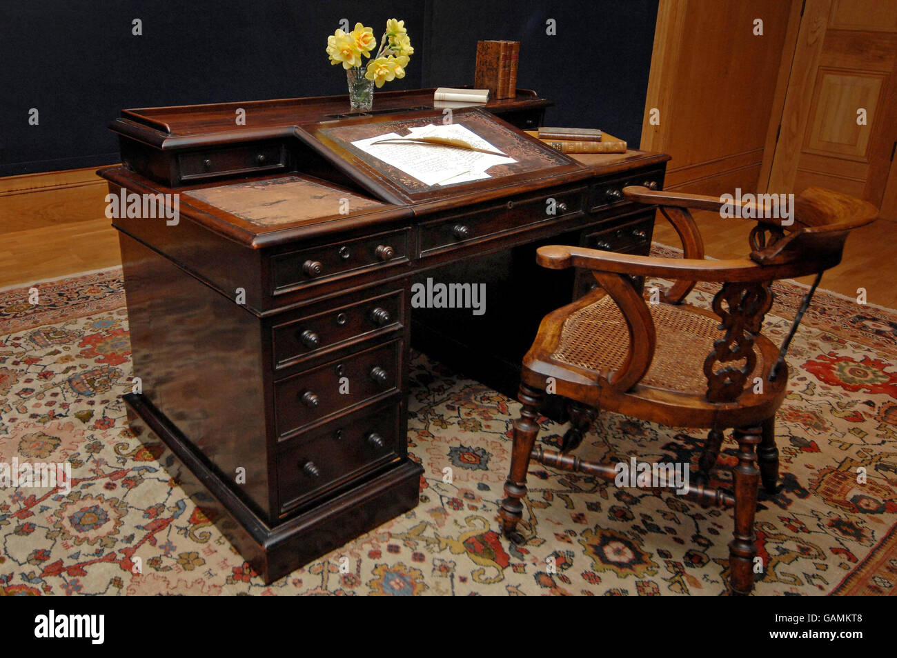 The writing desk and chair of author Charles Dickens, on which he penned a number of his later novels and short stories including Great Expectations, at the auction house Christie's in London ahead of its sale on June 4 in the Valuable Books and Manuscripts auction. Stock Photo