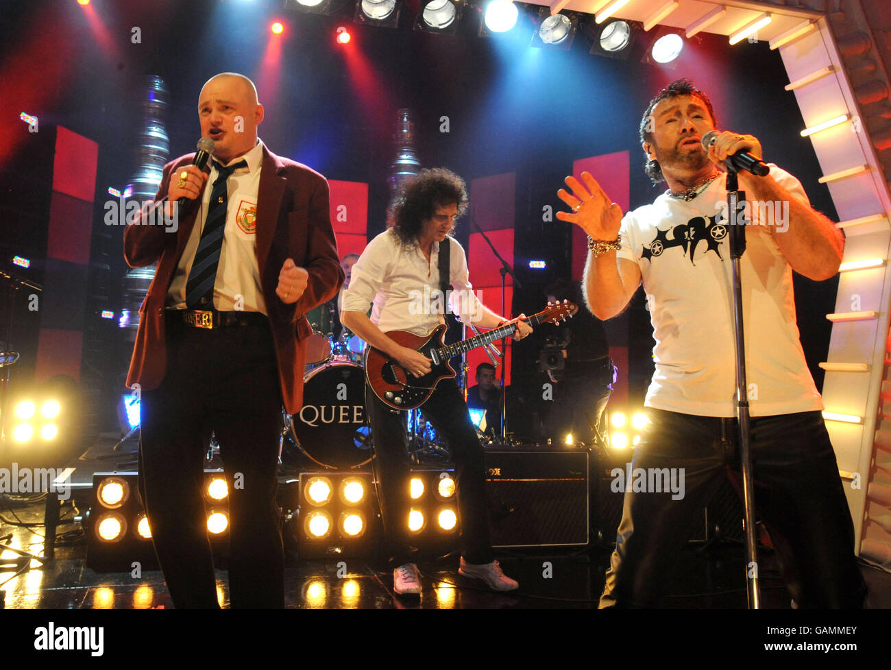 (Left-right) Host Al Murray, Brian May & Paul Rodgers of Queen during their performance on 'Al Murray's Happy Hour' (TX: ITV1 Friday April 4, 2008 @ 2200), London Studios, SE1. Stock Photo