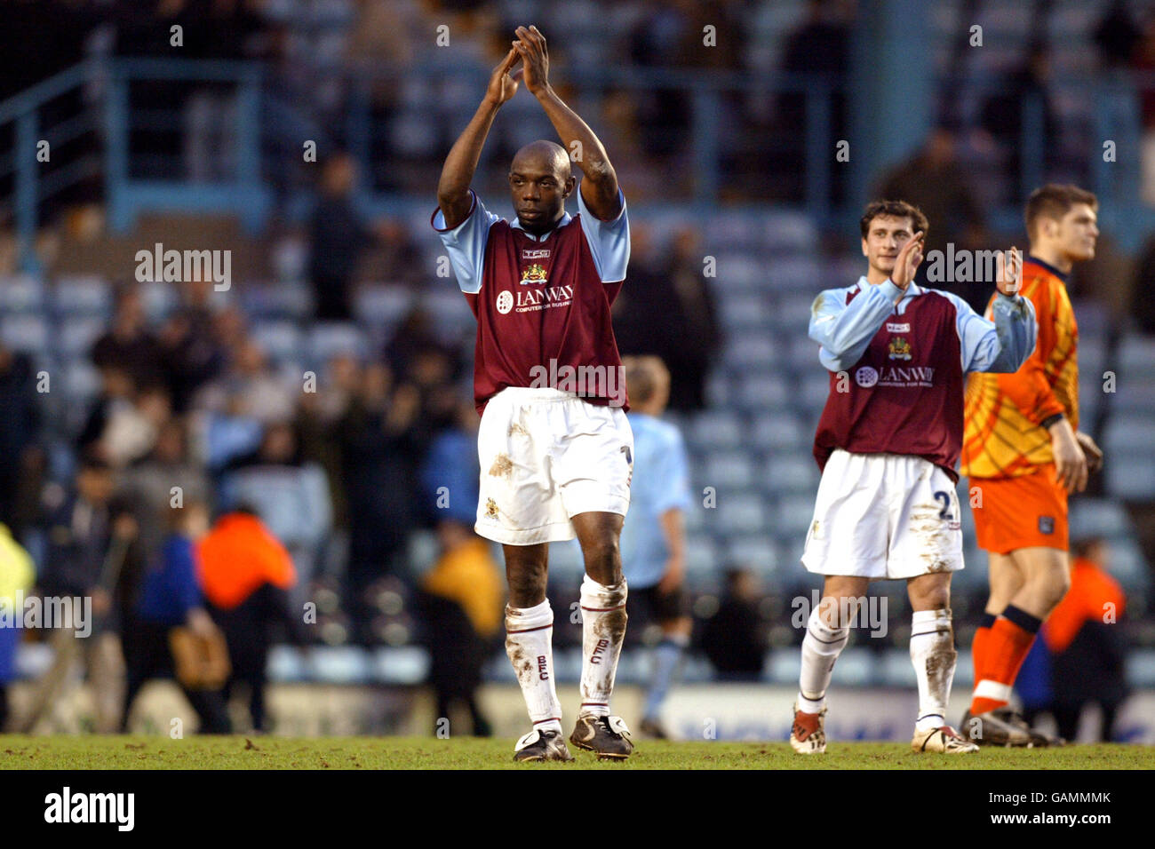 Burnley's scorer Ian Cox applauds the away fans at the end of the game