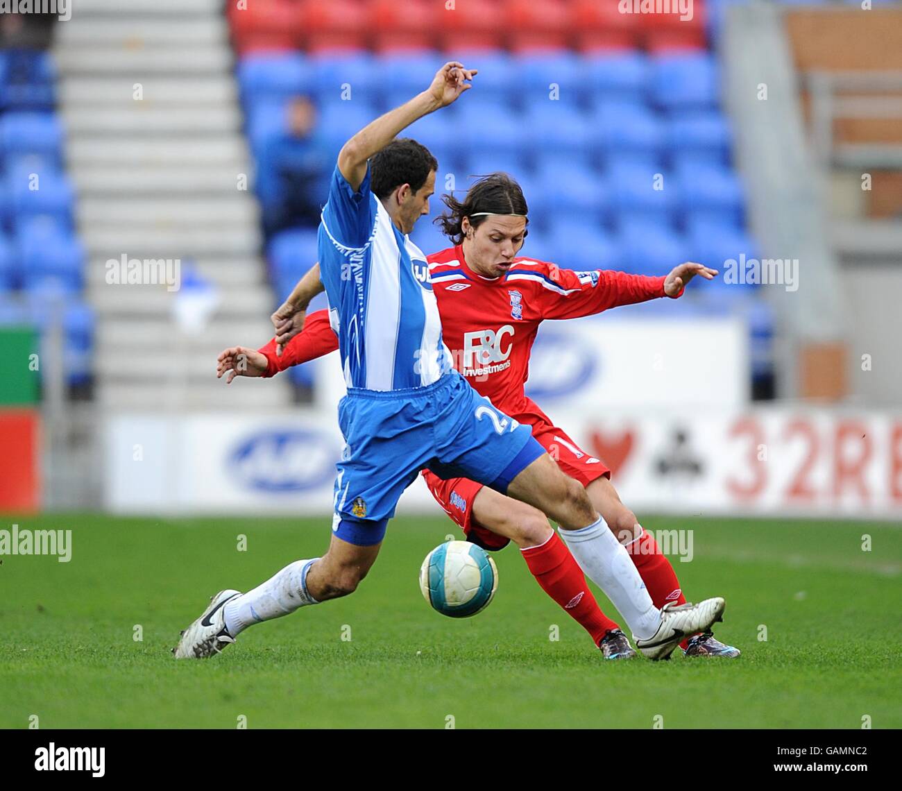 Birmingham City's Mauro Zarate and Wigan Athletic's Josip Skoko battle for  the ball Stock Photo - Alamy