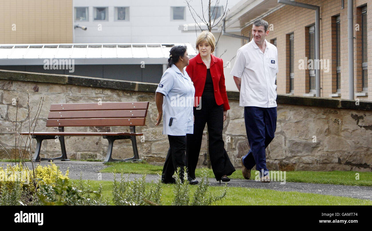 Left to right. Staff Nurse Laleeta Seebaluck, Health Secretary Nicola Sturgeon and Auxiliary Nurse Kevin McCann chat during the official opening of the new Gartnavel Royal Hospital in Glasgow. Stock Photo