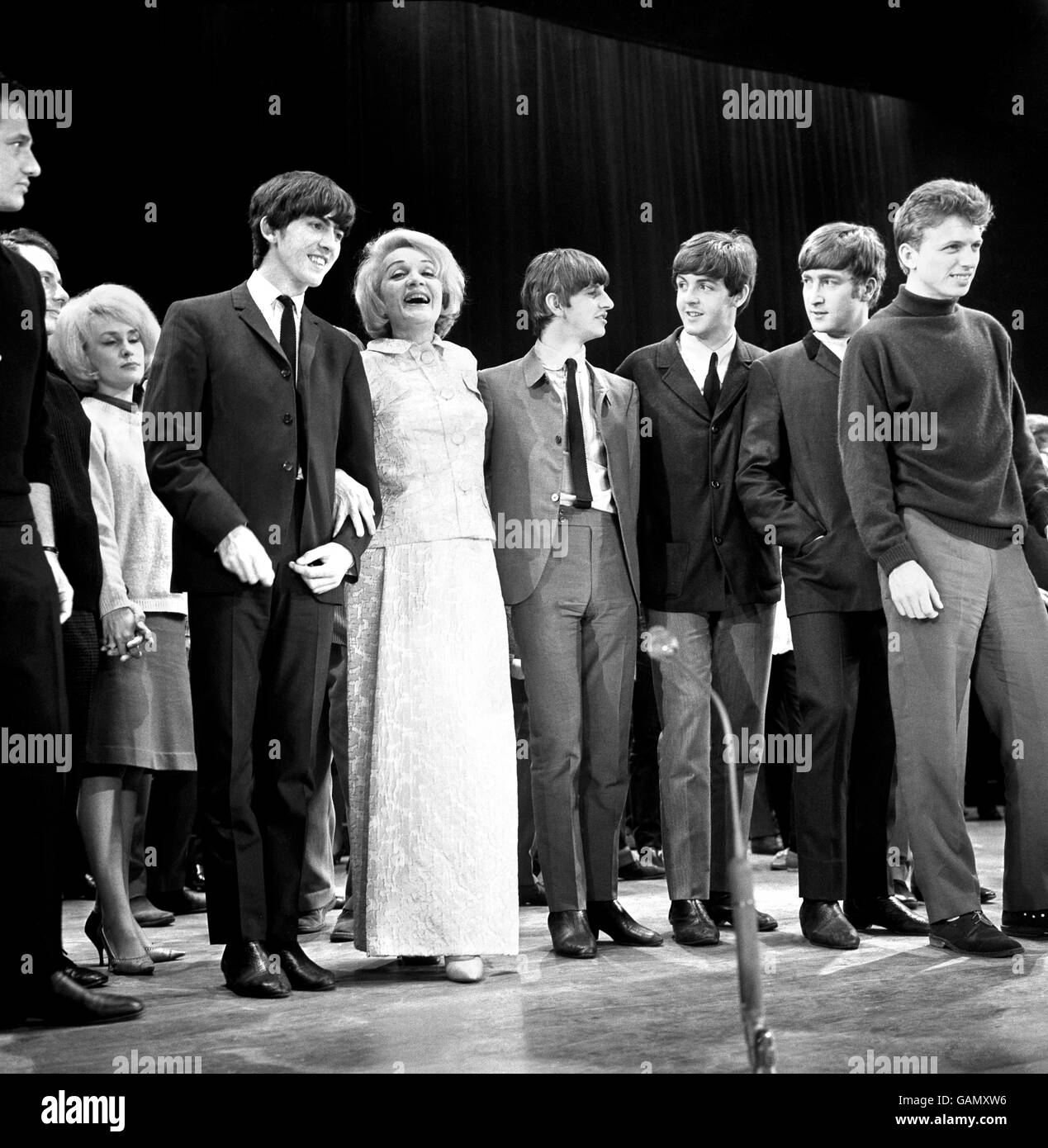 Hollywood's ageless 'glamorous grannie', Marlene Dietrich, joins some of the new generation of entertainers, The Beatles and singer-actor Tommy Steele (extreme right), on the stage of the Prince of Wales theatre, London. Stock Photo