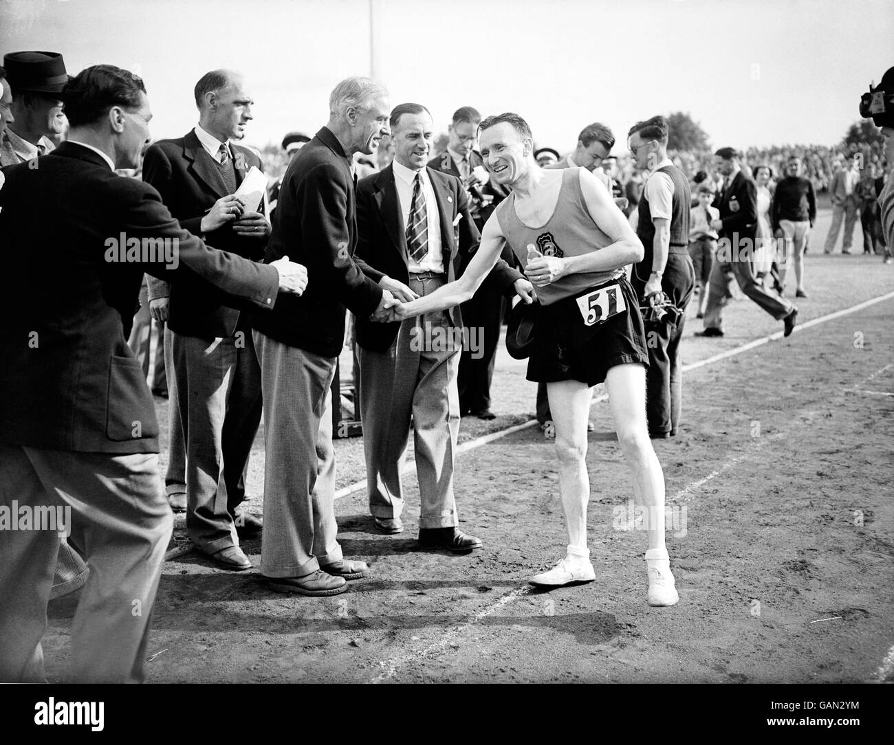 Athletics. Jim Peters receives congratulations after winning the marathon at the Polytechnic Stadium, Chiswick Stock Photo