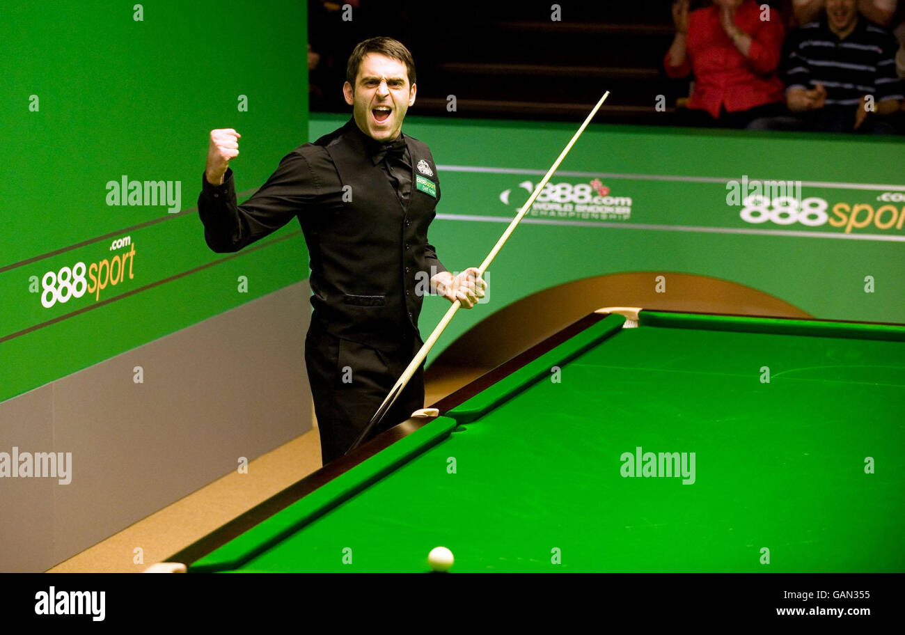 Ronnie OSullivan celebrates after scoring a maximum break of 147 to win his match against Mark Williams during the 888 World Snooker Championship at the Crucible Theatre, Sheffield Stock Photo