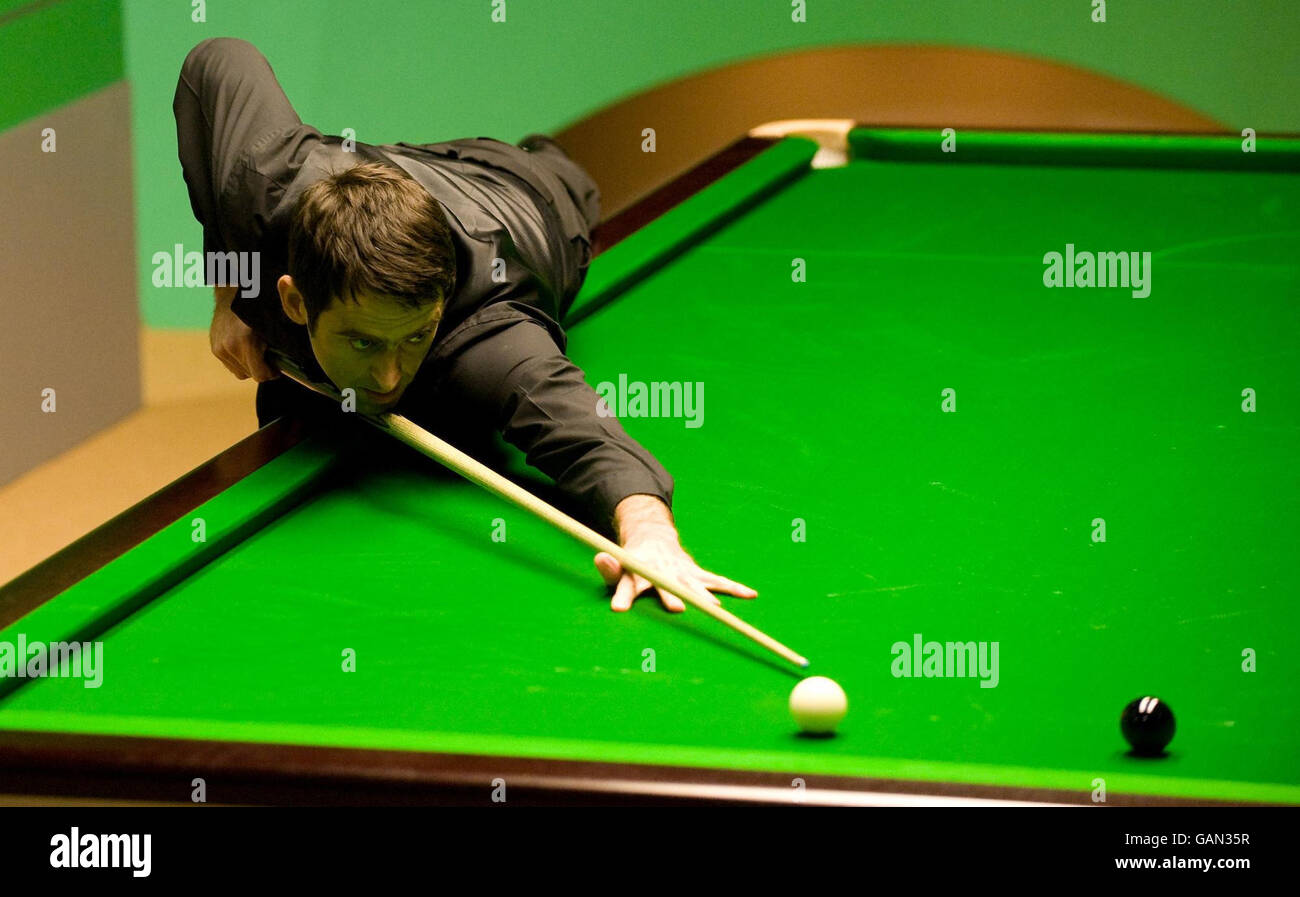 Ronnie OSullivan pots the final black to score a maximum break of 147 and win his match against Mark Williams during the 888 World Snooker Championship at the Crucible Theatre, Sheffield Stock