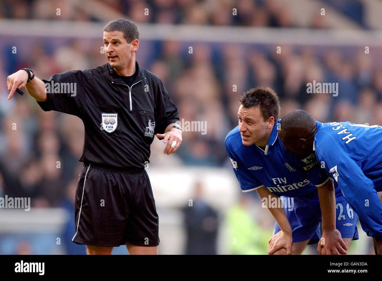 Soccer - FA Barclaycard Premiership - West Bromwich Albion v Chelsea. Chelsea's John Terry (c) and teammate Jimmy Floyd Hasselbaink (r) get a talking to from referee Andy D'Urso Stock Photo