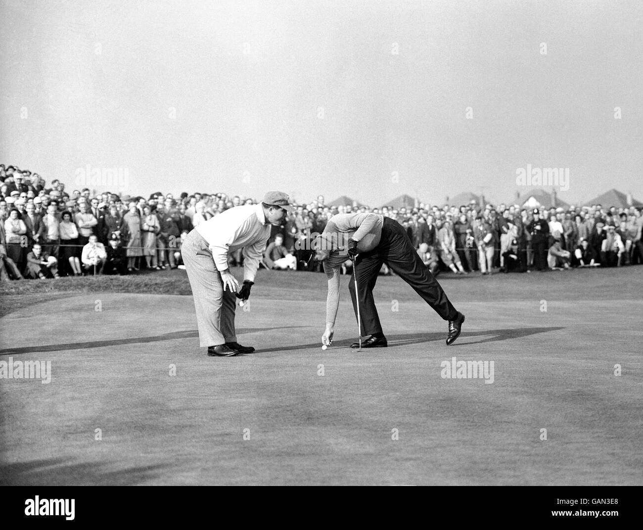 Golf - Ryder Cup - Great Britain and Ireland v USA - Royal Lytham and St Annes. Mike Souchak and his partner Bill Collins of the USA discussing a putt. Stock Photo