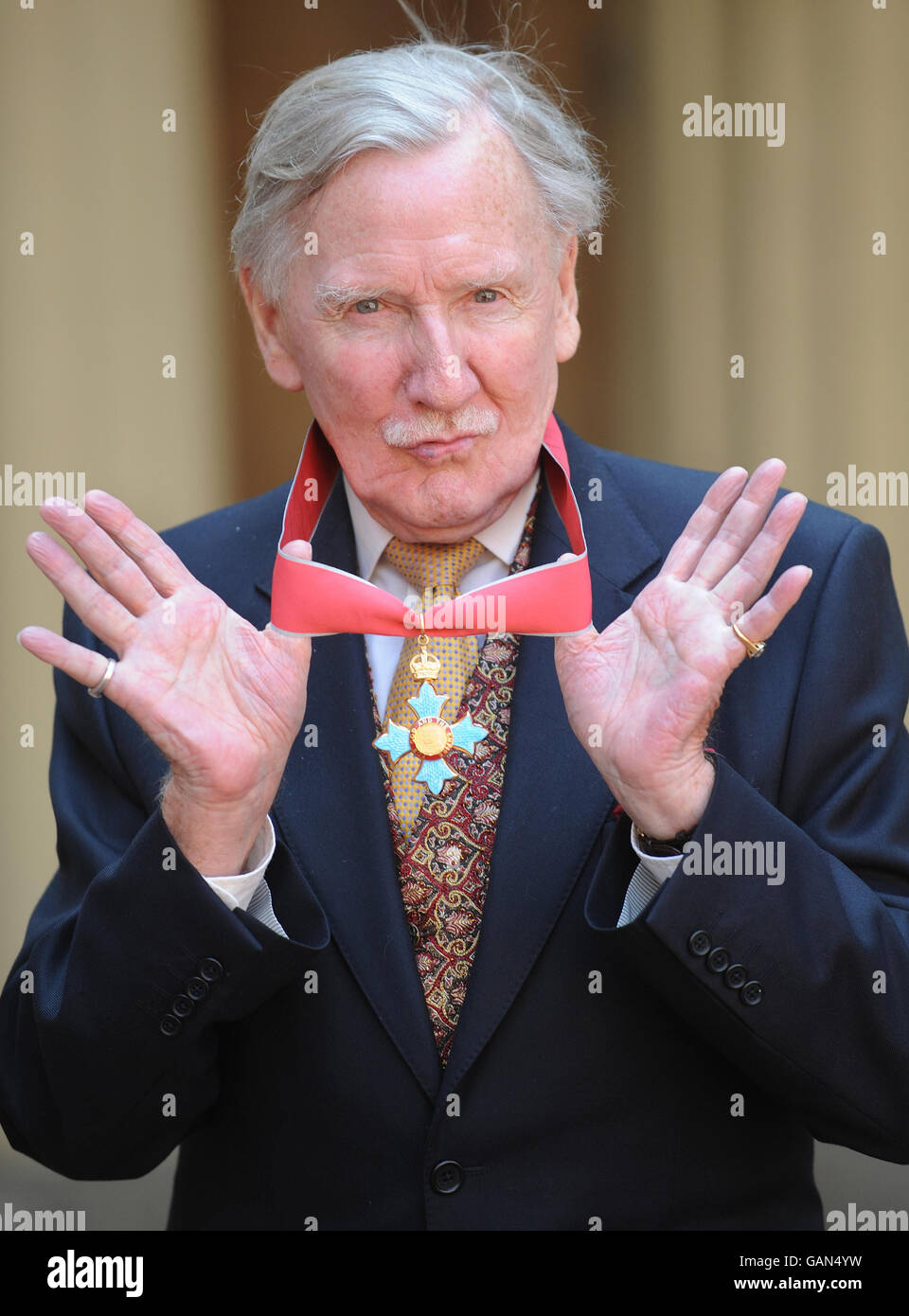 Actor Leslie Phillips with his CBE, which was given to him by Britain's Queen Elizabeth II at Buckingham Palace, London. Stock Photo