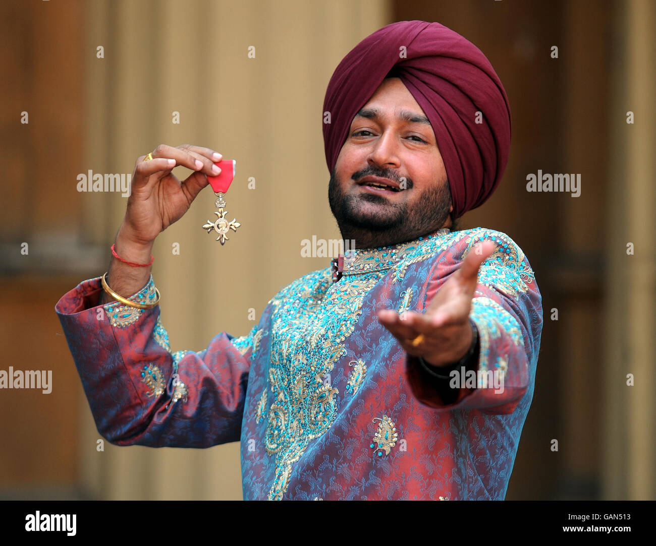 Malkit Singh, 48, a renowned Bangra singer from Sutton Coldfield, West Midlands after he collected an MBE from Queen Elizabeth II during an investiture ceremony at Buckingham Palace, London. Stock Photo