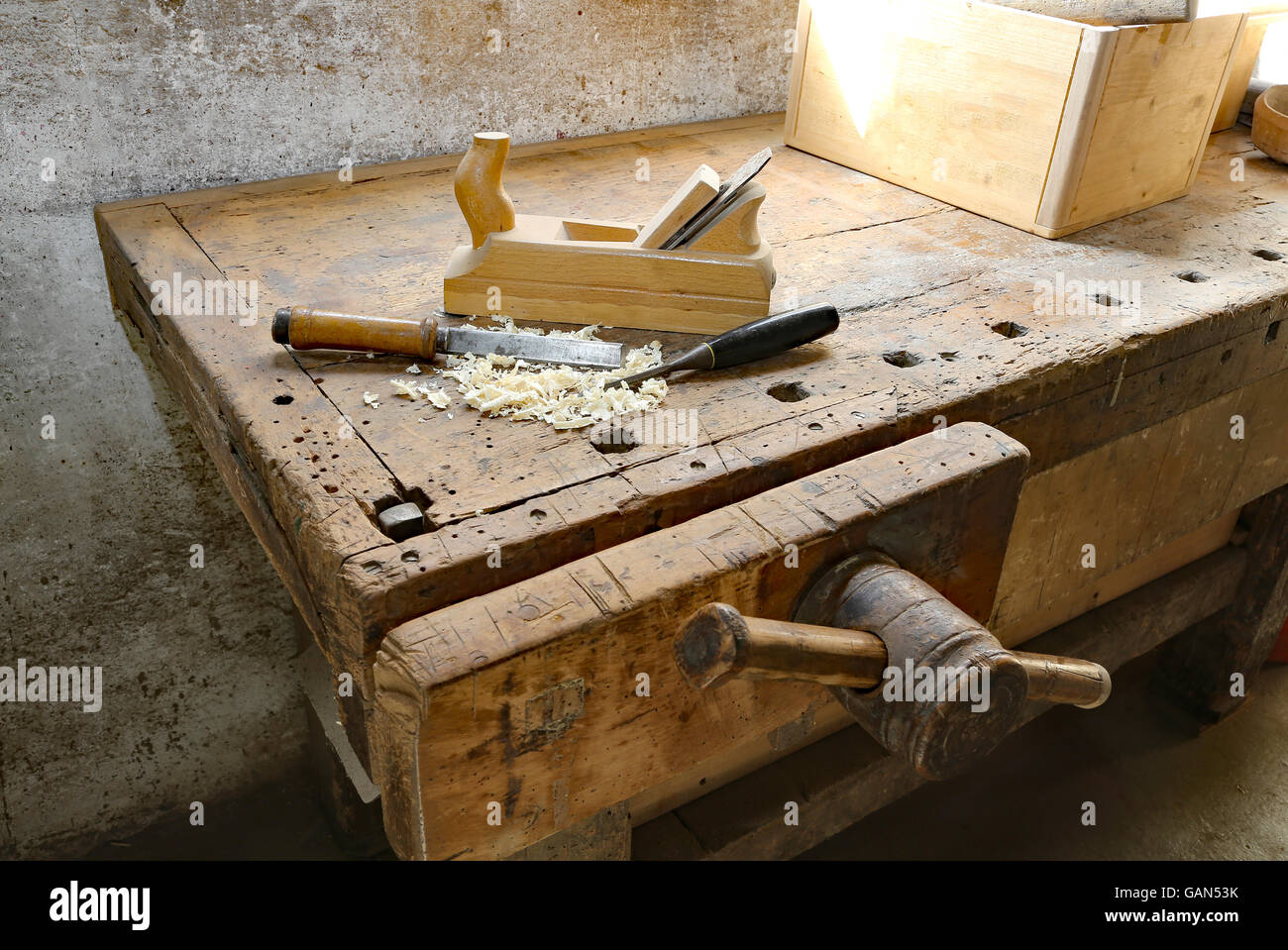 plane and chisels and a saw on the Workbench with a wooden grip inside the craftsman joinery manufacturer Stock Photo
