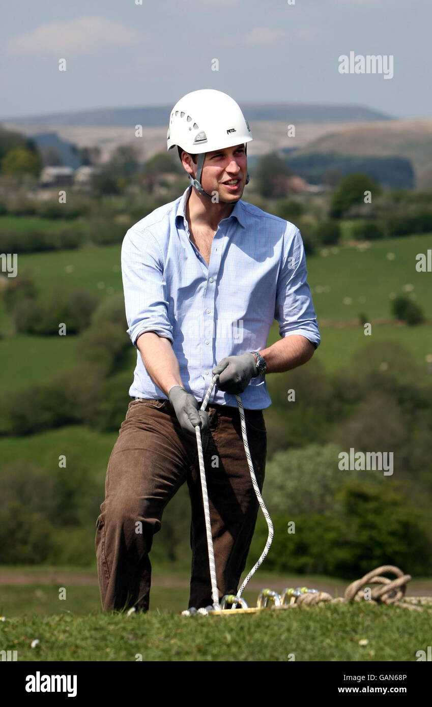 Prince William receives his instructions before belaying a rope as a casualty is lowered down a 200ft cliff at Morlais Quarry near Merthyr Tydfil, Wales. Stock Photo