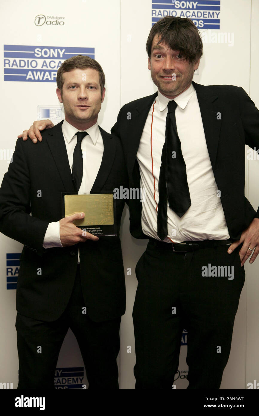 Dermot O'Leary (left) with the Music Programme Award presented by Alex James (right) during the Sony Radio Academy Awards at the Grosvenor House Hotel in central London. Stock Photo