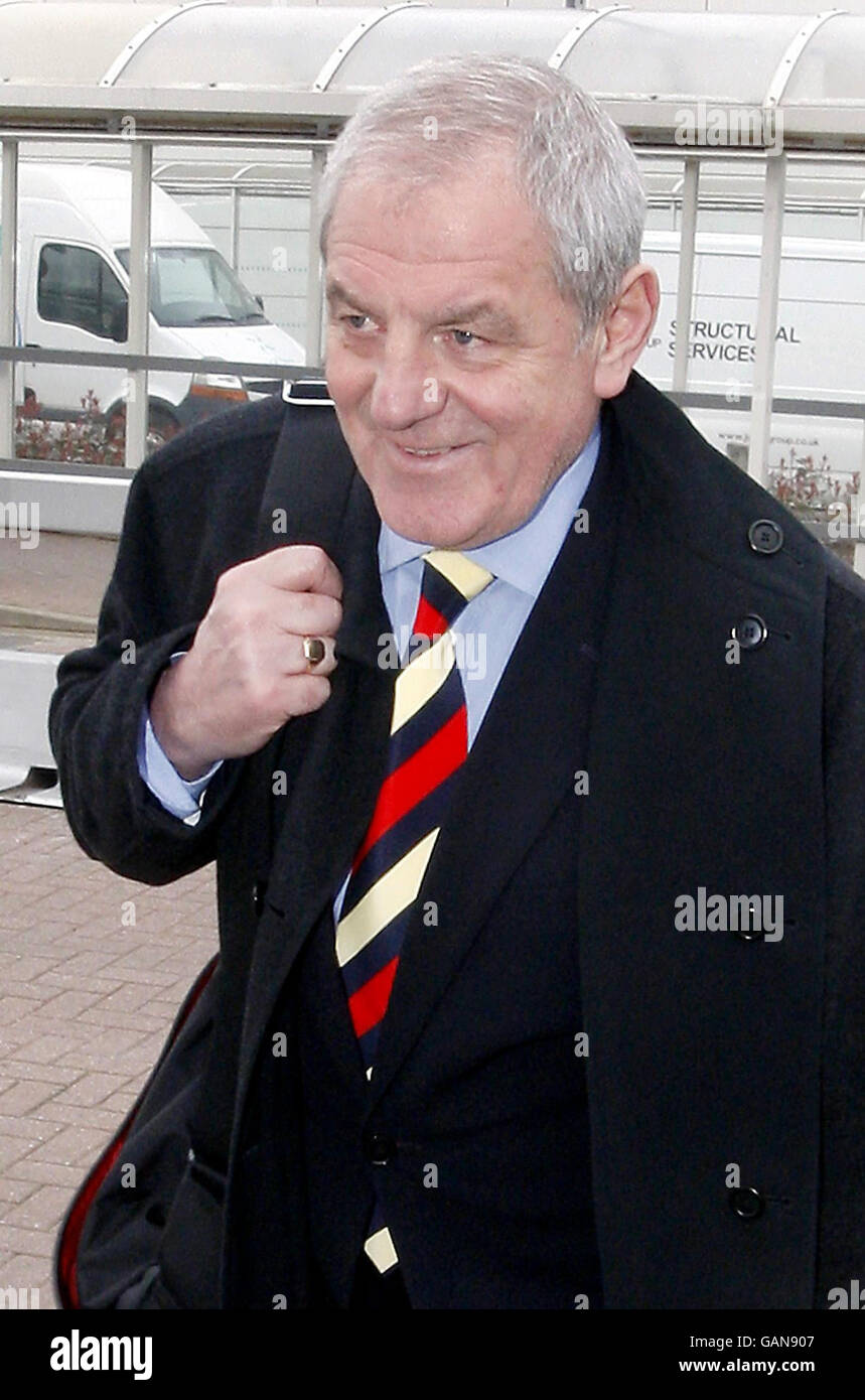 Rangers manager Walter Smith arrives back at Glasgow Airport following