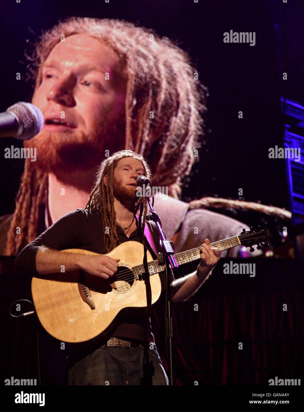 Newton Faulkner performing on stage during the Teenage Cancer Trust week of gigs, at the Royal Albert Hall in west London. Stock Photo
