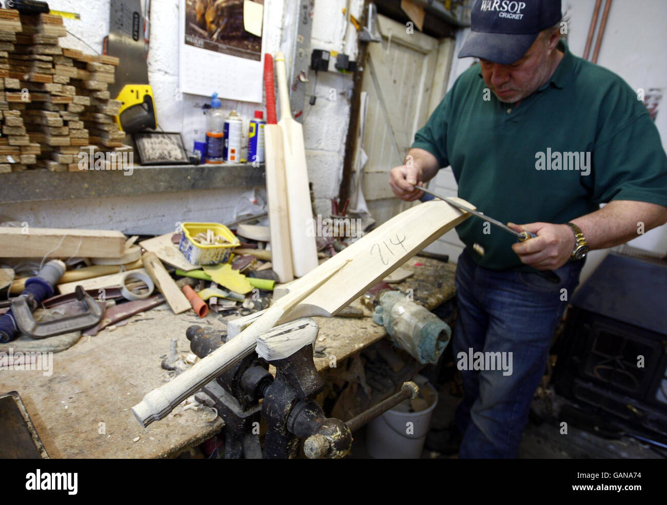 Handmade cricket bat maker Tony Sains at work getting bats ready for
