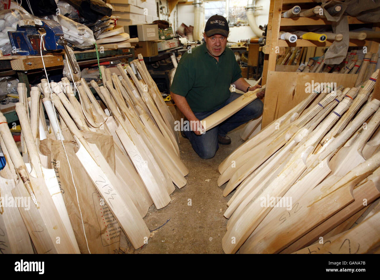 Handmade cricket bat maker Tony Sains at work getting bats ready for