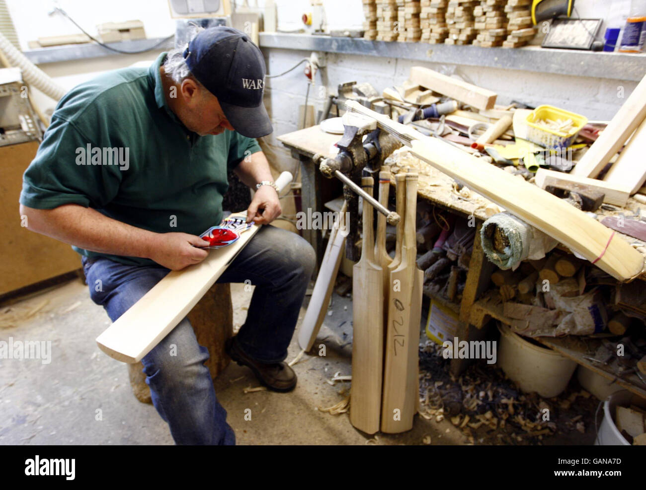 Handmade cricket bat maker Tony Sains at work getting bats ready for