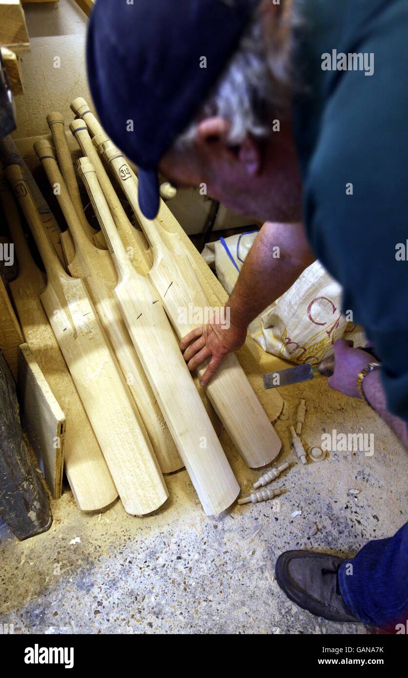 Handmade cricket bat maker Tony Sains at work getting bats ready for